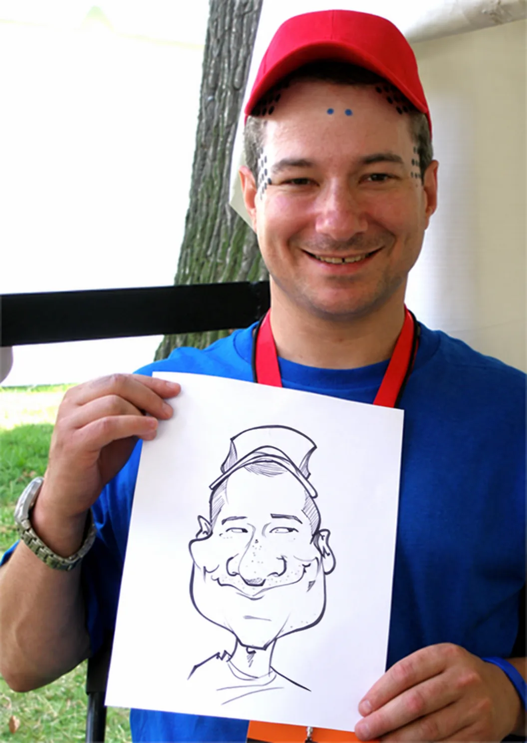 Live event caricature of a man in a red cap