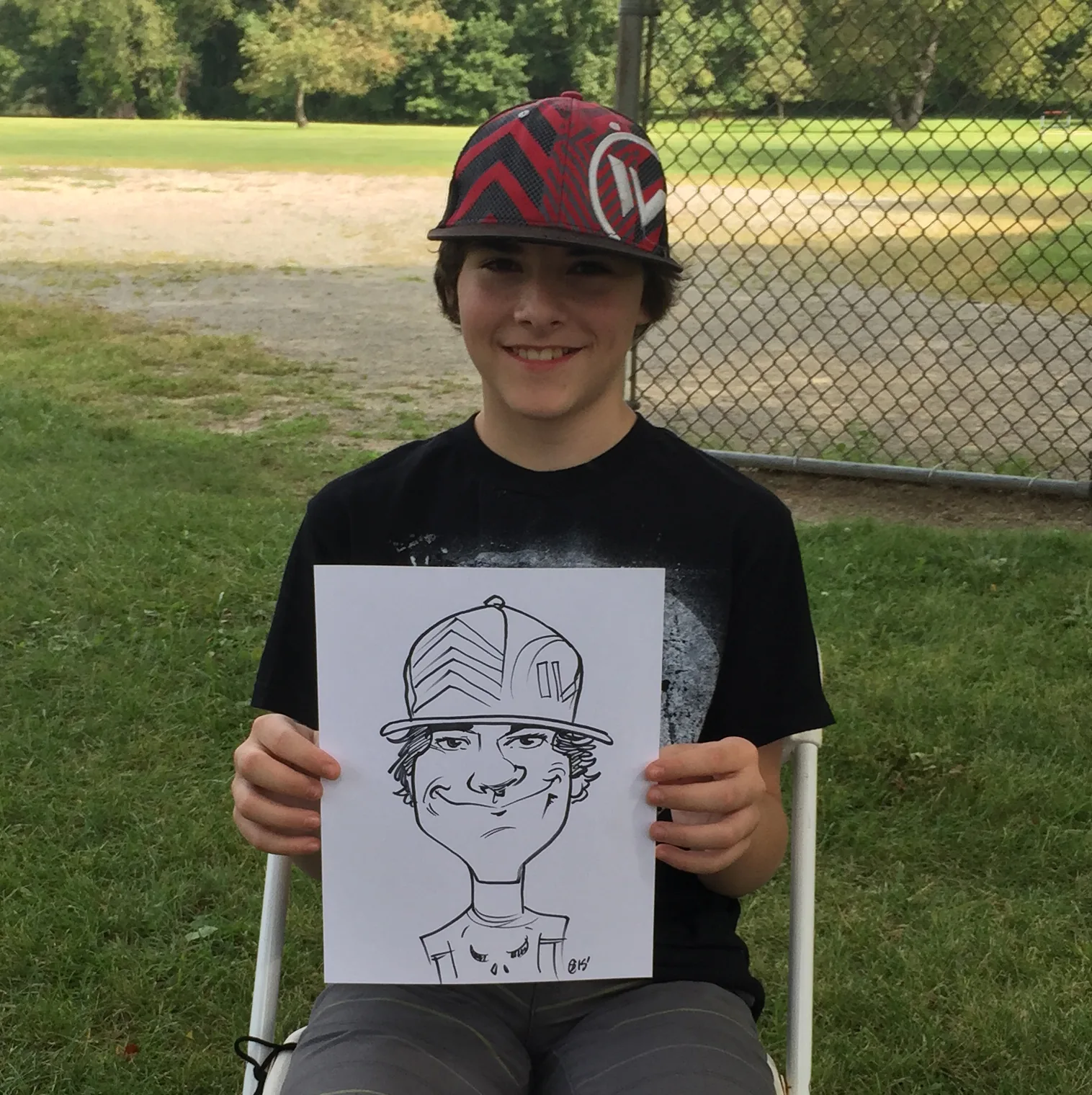 Live event caricature of a teen in a sports cap